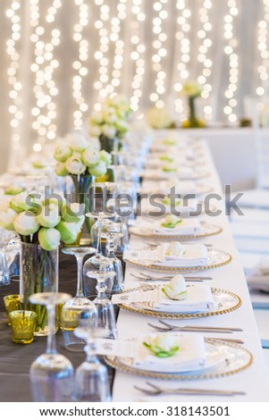 Elegance table set up with lotus flowers, selective focus. (set)