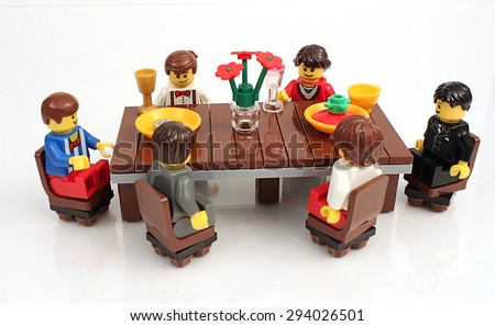 Colorado, USA - June 27, 2015: Studio shot of Lego minifigures portraying dinner scene on white background.