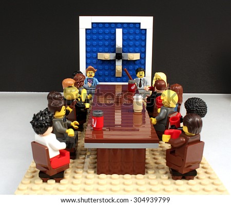 Colorado, USA - June 27, 2015: Studio shot of Lego minifigures portraying board meeting scene on white background.