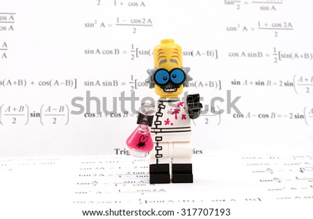 Colorado, USA - September 17, 2015: Studio shot of Lego minifigure Mad Scientist surrounded my math formulas.