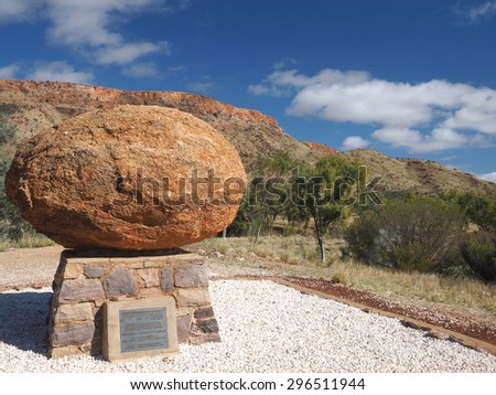Alice Springs, Australia - 2015, June 30: The grave of John Flynn, the great outback developer, called Flynn\'s Grave and Mount Gillen in the back, Alice Springs