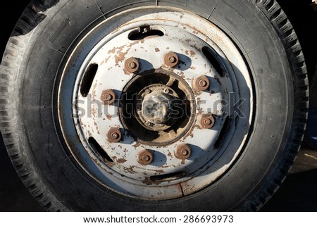The wheel hub and the tire of the truck.