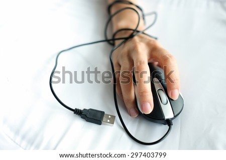 The mouse wire warp the hand of user,  represent the human that already addicted computer and technology , like a slave of computer and technology ,can not untied.