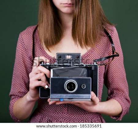 vintage camera in the hands of the girl
