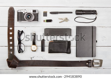 tourism  concept - set of cool stuff with camera and other travel things on wooden table