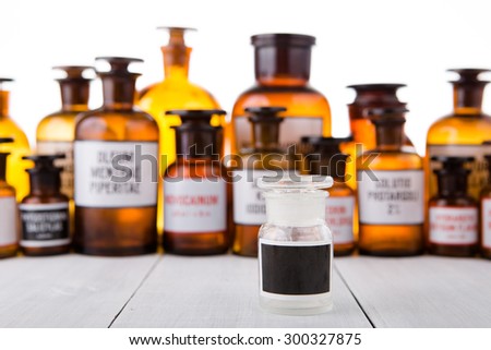 medicine bottle with blank label on wooden table