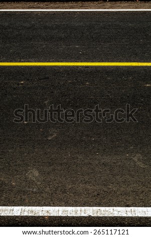 Yellow stripes on the road as a background