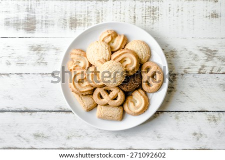 Butter Cookies in white ceramic dish on wood table