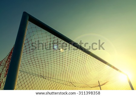 Vintage photography with soccer goal with lens flare effect
