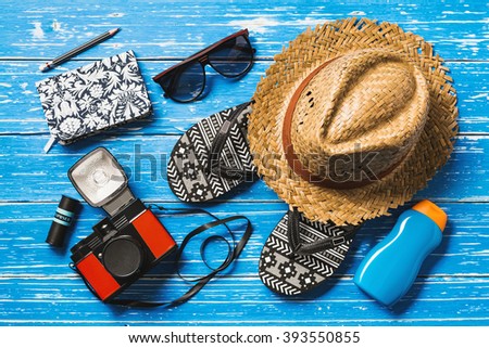 Summer holiday background, Beach accessories on blue distressed wood table, Vacation and travel items