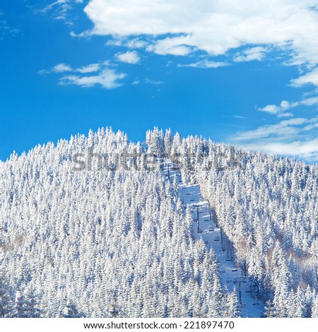 Cable railway on mountain covered with snow