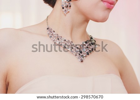 beautiful girl with sparkling jewelry and perfect skin is waiting for her wedding