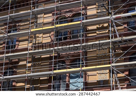 building construction site with scaffolding -  facade renovation
