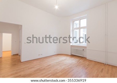 fresh renovated room with wooden oak floor, white walls and window
