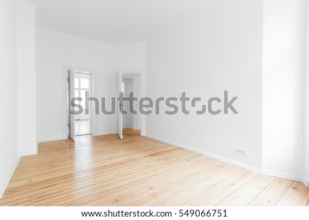 Empty apartment room with wooden floor