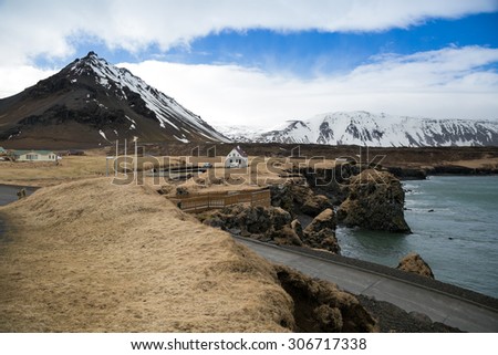 Iceland, June 2015. Iceland coast line against gigantic mountains.
