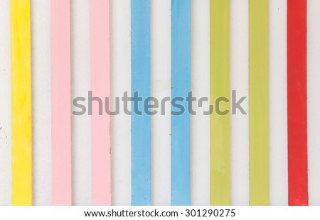 Colorful stripe made from wood hang on the wall for art decoration