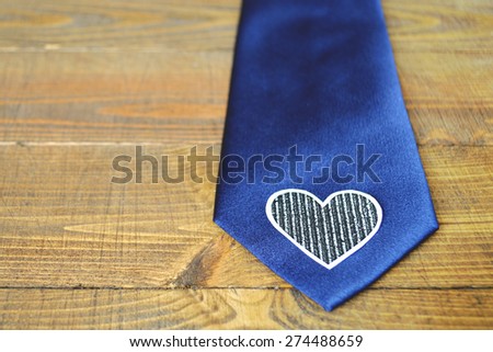 Father\'s Day gift: a blue tie on wooden background