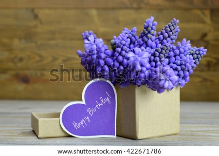 Happy Birthday card and flowers arranged in gift box