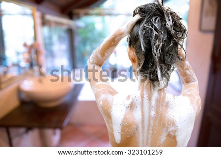 Woman bathing in the bathroom