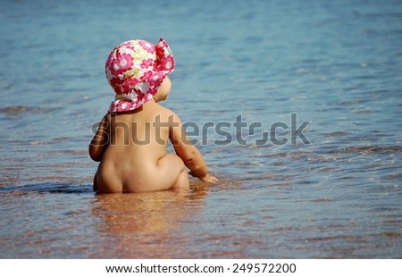 Families with young children. Family vacation. Vacation at sea. Beach. Sunny weather. Small children. Beautiful hats. Happiness is being a mom.