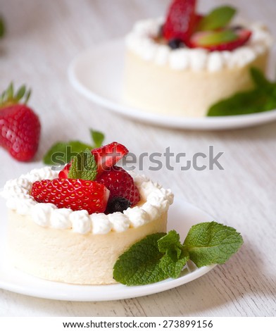 Mini cheesecake with strawberries and whipped cream,  delicious homemade cakes, festive food.