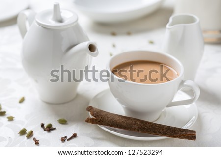 indian tea with milk in white dishware