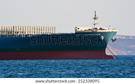 The bow of a huge container ship MOL Contribution anchored. Nakhodka Bay. East (Japan) Sea. 31.03.2014