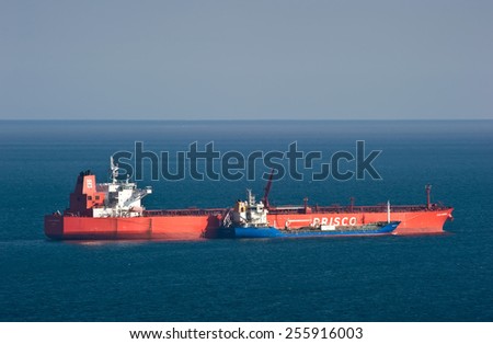 Bunkering tanker Nicholay Shalavin tanker Zaliv America. Nakhodka Bay. East (Japan) Sea. 30.03.2014