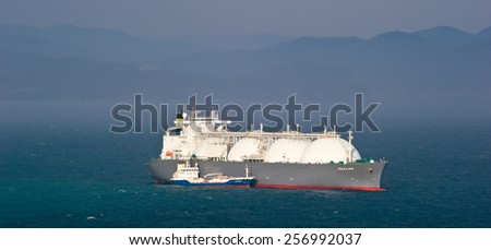 Tanker Nicholay Shalavin on raid bunkering anchored tanker Fuji LNG. Nakhodka Bay. East (Japan) Sea. 05.05.2014