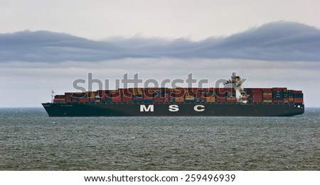 Large container ship MSC Madeleine loaded at anchor in the roads. Nakhodka Bay. East (Japan) Sea. 20.05.2014