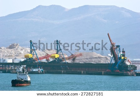Loading of coal on the ship, standing at the pier in the port of Nakhodka. East (Japan) Sea. 02.03.2015