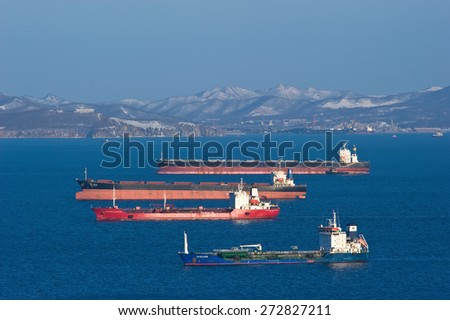 Bulk carrier Mineral Haiku, bulk carrier Twin Dragon, tanker Vladimir Vysotsky and tanker RN Polaris anchored in the roads. Nakhodka Bay. East (Japan) Sea. 05.03.2015