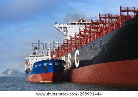 Bunkering tanker Vitaly Vanukhin container ship MSC company. Nakhodka Bay. East (Japan) Sea. 22.07.2015