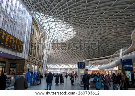 London, UK -- Mar 14, 2015: A view of New King\'s Cross Station Architecture with people walking in morning