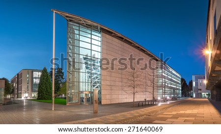 Cambridge, UK - April 14, 2015: Sidgwick Site, one of the largest sites within the University of Cambridge, England, UK in Twilight. Also a modern design building located on West Area of Cambridge.