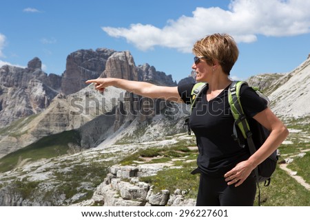 Woman looking at the magnificent mountain landscape