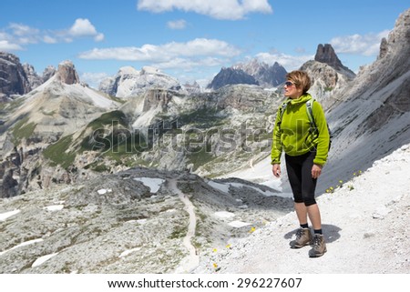 Woman looking at the magnificent mountain landscape