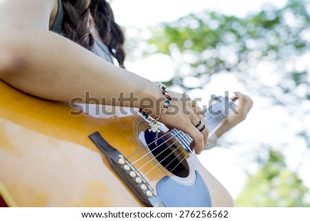 The practice of playing the guitar.Women playing guitar.
