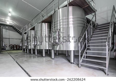 modern wine cellar with stainless steel tanks