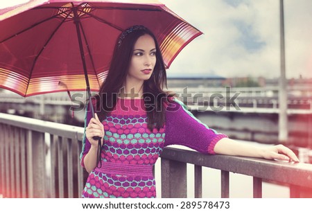 Rainy day, sad mood, the woman with an umbrella