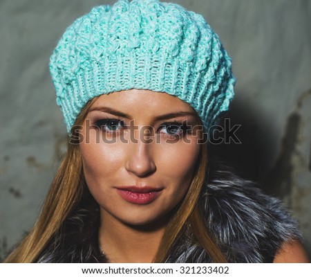 Autumn portrait of a fashionable woman in a menthol hat