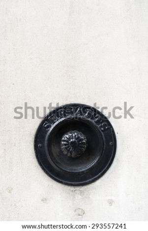 Black Press Victorian Doorbell.press button in the old wall.Inscript servant.Hotel reception service doorbell for assistance and support