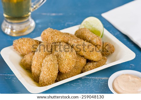 Fun easy food, fried crispy crumbed chicken with a jug of beer, tin of cutlery and dipping sauce. Great football food, weekend TV lunch, relaxation food or just easy eating.