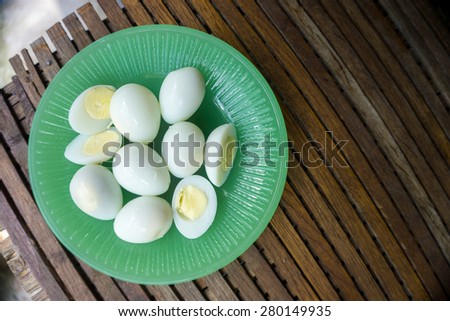 Plate of Boiled Quail Eggs on a Bamboo Mat Background
