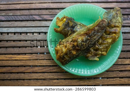 Fried catfish on the wood background