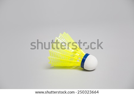 Badminton shuttlecock on a grey background