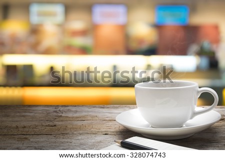 Wood table or wood floor on blur counter bar of coffee cafe or nightclub background