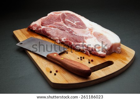 Meat pork fresh. Raw meat on cutting board. Spice and meat. Axe and meat pig. Fat piece