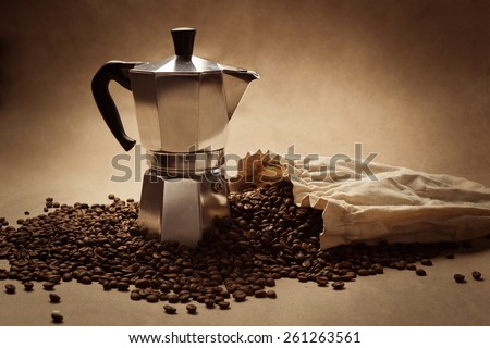 Coffee pot and coffee beans. Paper texture coffee. Dark coffee roasted. Bag of coffee, spill. Coffee beans